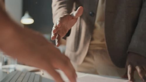 Business Handshake Concluding a Meeting in Office