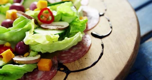 Fresh Salad on Wooden Board with Garnish