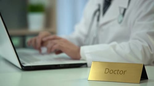 Doctor Typing Diagnosis on Laptop, Keeping Medical Records, Consultation