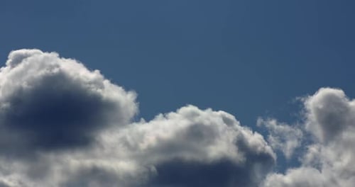 Billowing Clouds Floating in the Blue Sky