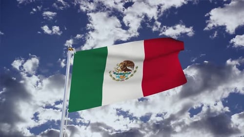 Mexican Flag Waving Against a Cloudy Blue Sky