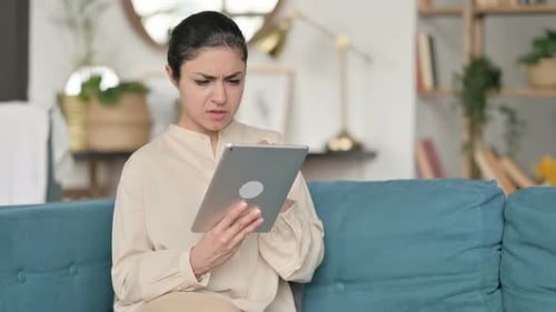 Loss Indian Woman Reacting to Failure on Sofa