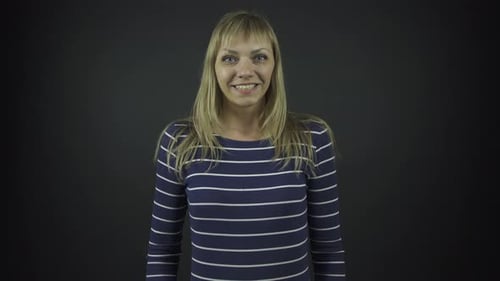 Smiling Blonde Woman Looking at Camera