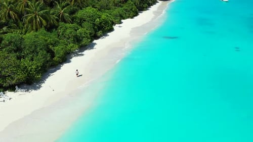Girl tans on tranquil sea view beach holiday by aqua blue sea and white sand background of the Maldi