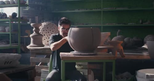 Potter Shaping Clay Bowl in Bright Studio