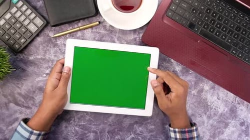 Top View of Businessman Using Digital Tablet on Office Desk