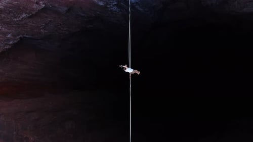Extreme Sport of Slacklining Top View on a Man Walking the Tightrope