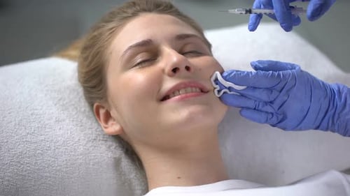 Young Woman Receives Facial Injections for Beauty