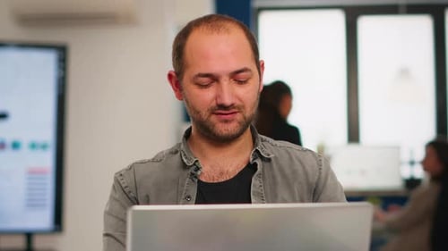 Man Working at Computer in Modern Office
