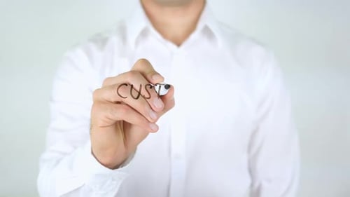 Writing Customer Satisfaction with Marker on Clear Surface