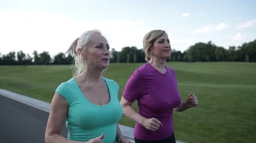 Mature Women Enjoying a Run in the Park