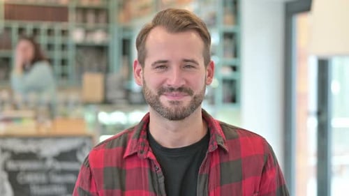 Close Up of Smiling Man in Coffee Shop