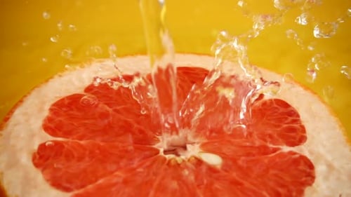 Juicy Grapefruit Getting Sprayed with Water