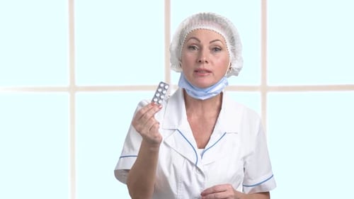 Medical Professional Explains Medication in a Clinical Setting