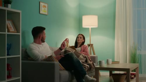 Couple Relaxing Together in Living Room