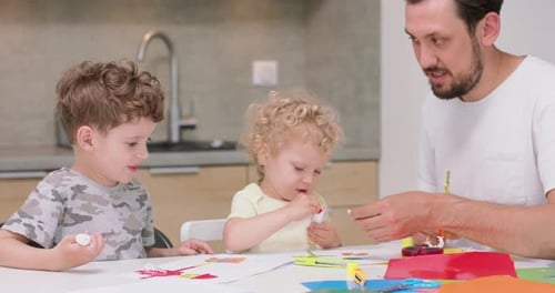 Kids Doing Arts and Crafts with Father