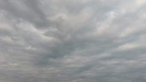 Gray Clouds Rolling Across Blue Sky