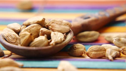 Close Up of Cardamom on a Spoon on Table