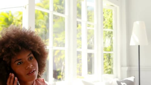 Woman Talking on Cell Phone Indoors in Modern Home