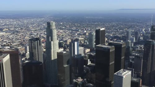 AERIAL: Wide View of Downtown Los Angeles, California Skyline at Beautiful Blue Sky and Sunny Day