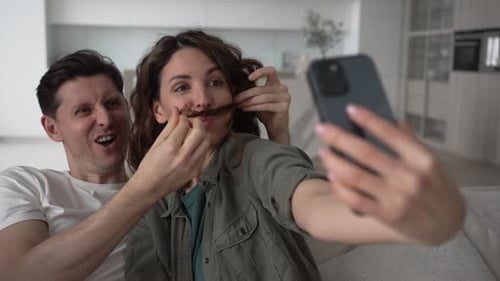 Couple Posing for Selfie with Hair Mustache