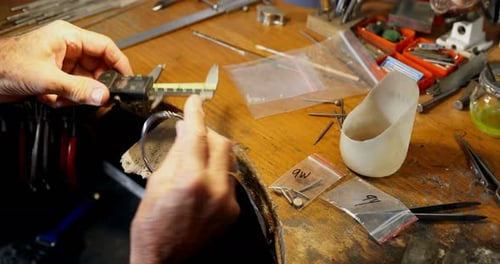 Goldsmith preparing bangle 4k