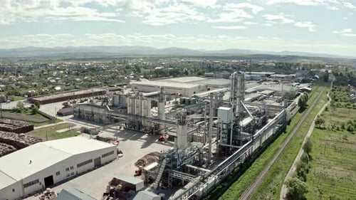 Aerial Drone View. Factory Industrial Zone, Wood Processing Factory Warehouses, Workers Inside the