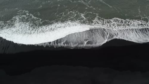 Drone Shot Of White Tide On Black Sand Beach