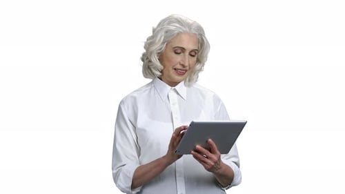 Mature Business Woman Using Digital Tablet