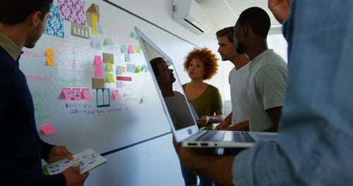 Creative Team Brainstorming Ideas in Modern Workplace