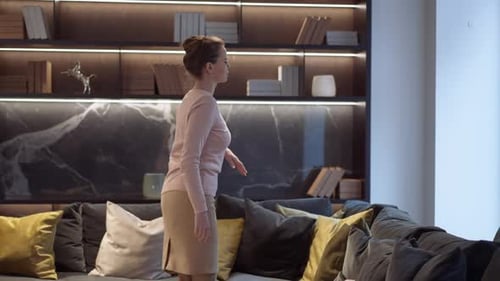 Woman Relaxes on Couch in Modern Apartment