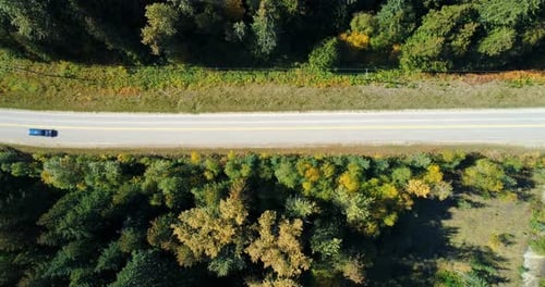 Aerial view of vehicle moving on road at countryside 4k