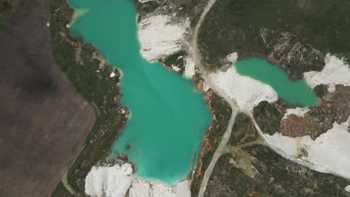 Aerial drone view Amazing industrial landscape, on Emerald lake in a flooded quarry