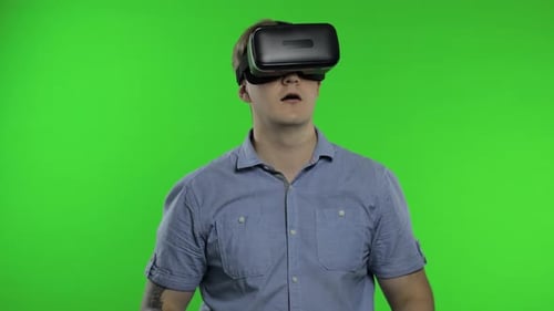 Man Using VR Headset Helmet To Play Game. Watching Virtual Reality 3d 360 Video. Chroma Key