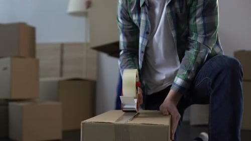 Man From Moving Service Helping Client to Pack and Carry Things From Apartment