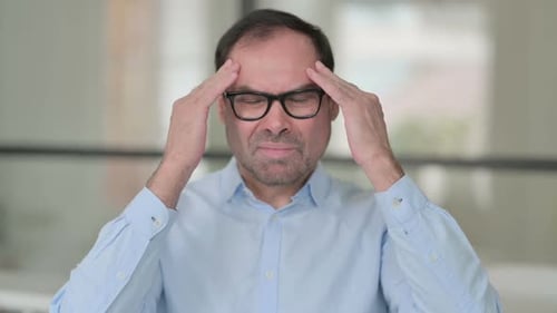 Middle Aged Man Having Headache