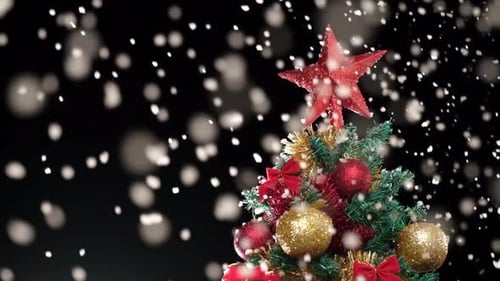 Festive Christmas Tree with Snow Falling