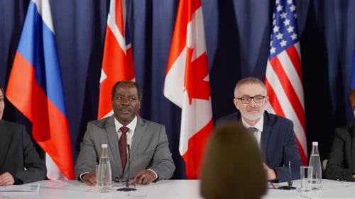 International Panel Speaks at Conference Table