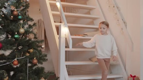 Girl Descends Stairs to Christmas Tree Presents