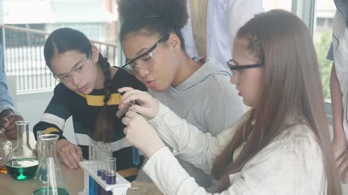 Diverse Students Conduct Science Experiment in Classroom