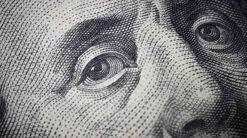 American one hundred dollar paper banknote in close up macro view dolly shot.