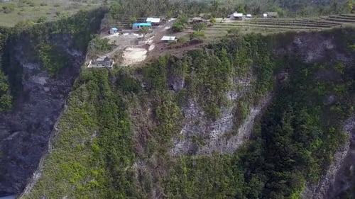 Great aerial view flight slider fly sideways from right to left drone shot
Kelingking Beach at Nusa