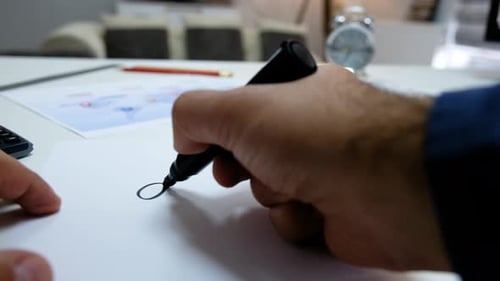 Hand Writing 'Great' with Black Marker on Paper