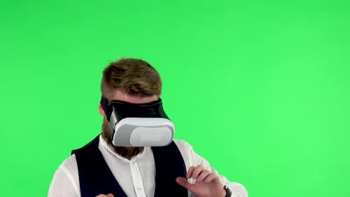 Man with Virtual Reality Headset or 3d Glasses. Green Screen