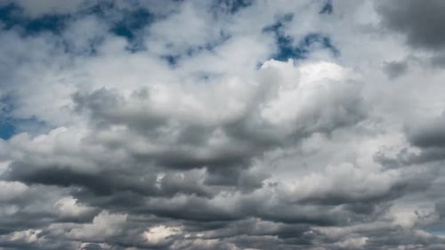 Ominous Grey Clouds Flowing in Blue Sky