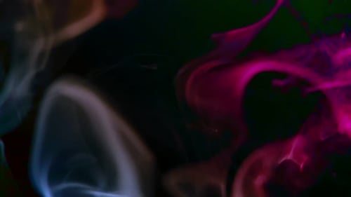 Colorful Abstract Smoke Flowing on a Dark Background