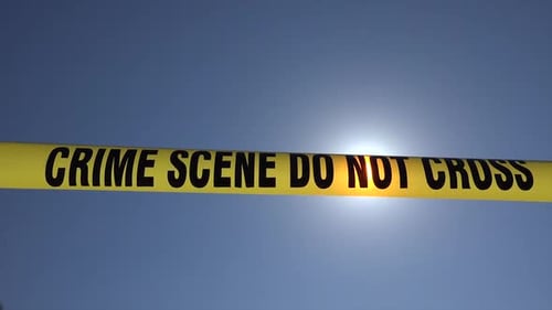 Crime Scene Tape with Sun Shining Through