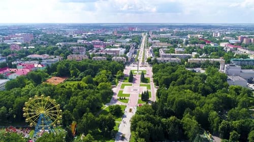 Town square in the park in summer cloudly day - Drone Footage