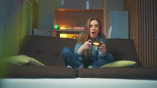 Excited Woman Playing Video Game at Home