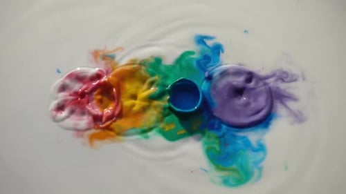 Colorful Liquid Splashing and Swirling in White Water